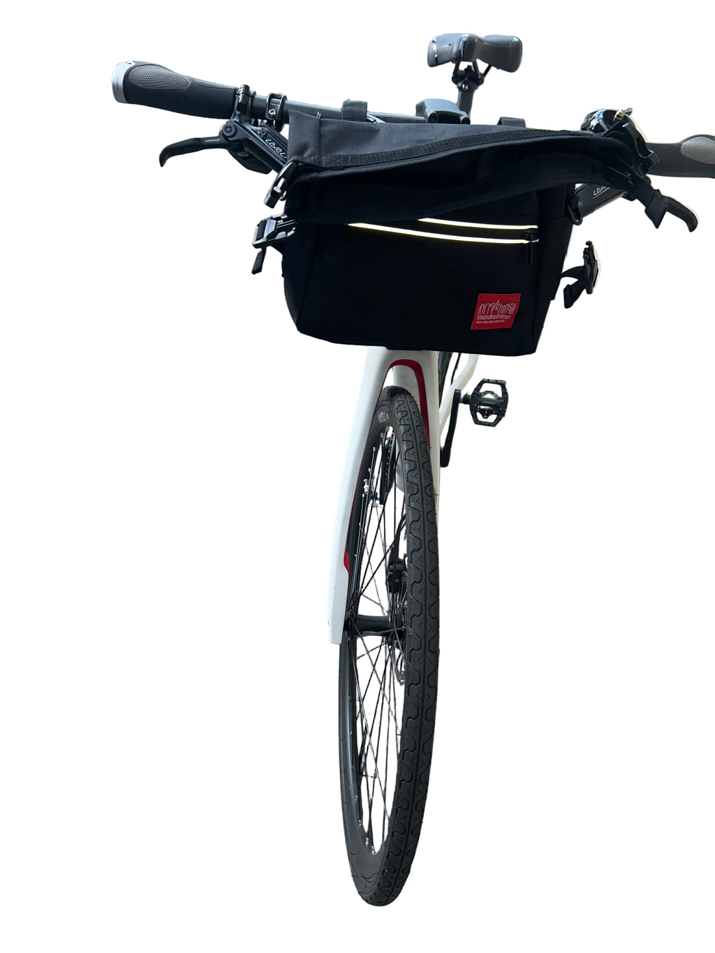 Bicycle with a black bag on a paved sidewalk