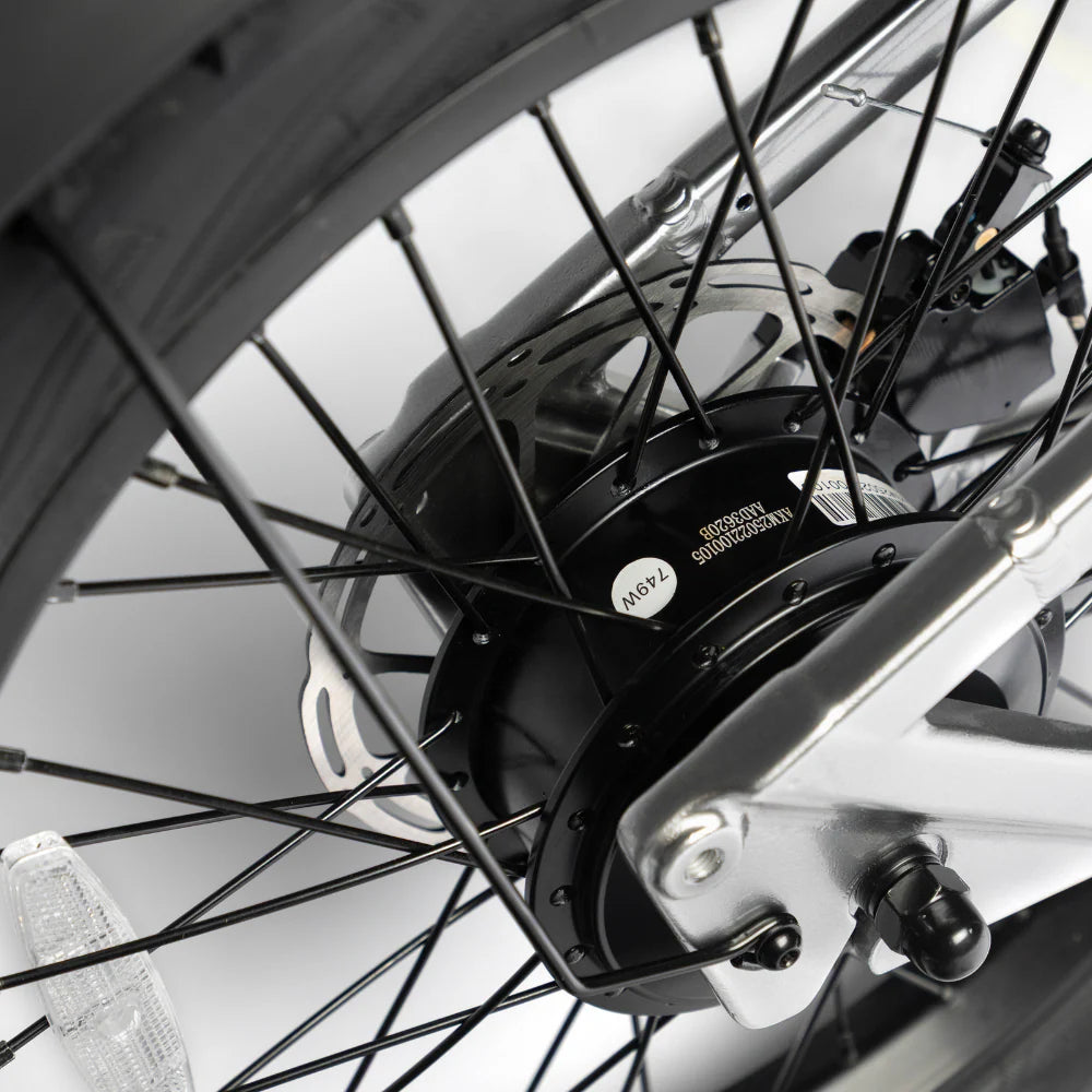 Close-up of a bicycle wheel with a gear and chain mechanism on a white background
