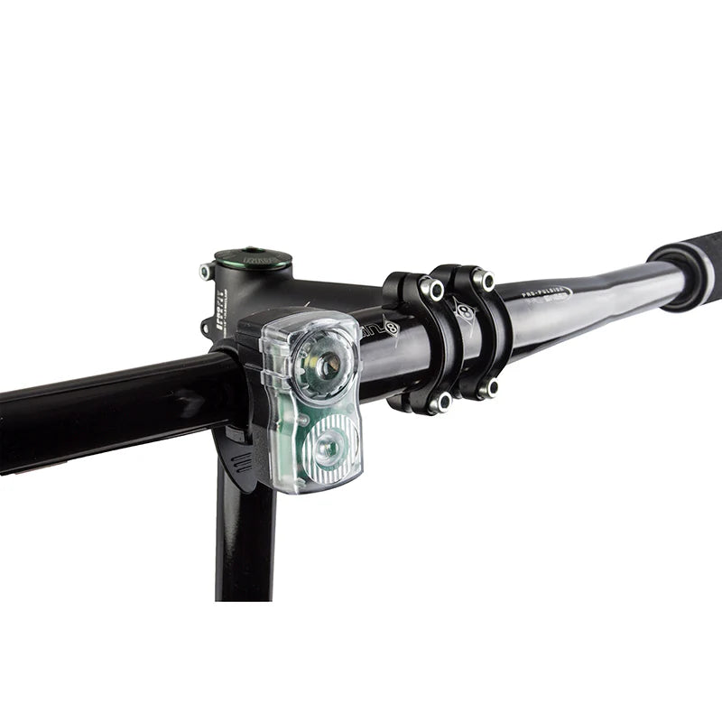 Bicycle handlebar with a light attached on a white background
