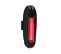A black bicycle tail light with a glowing red LED light bar, shown against a solid white background.