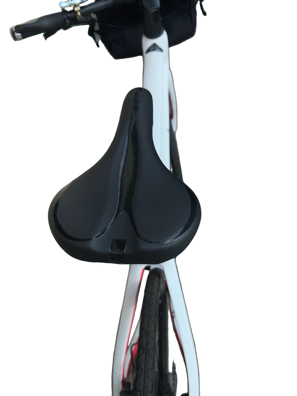Close-up of a bicycle seat on a paved surface