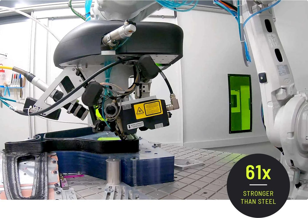Robotic arm with mechanical components in a factory setting, highlighting strength comparison to steel.