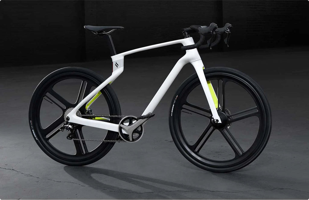 White bicycle with black tires on a dark background