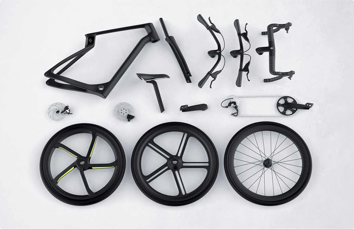 Bicycle components including frame, wheels, and handlebars on a white background