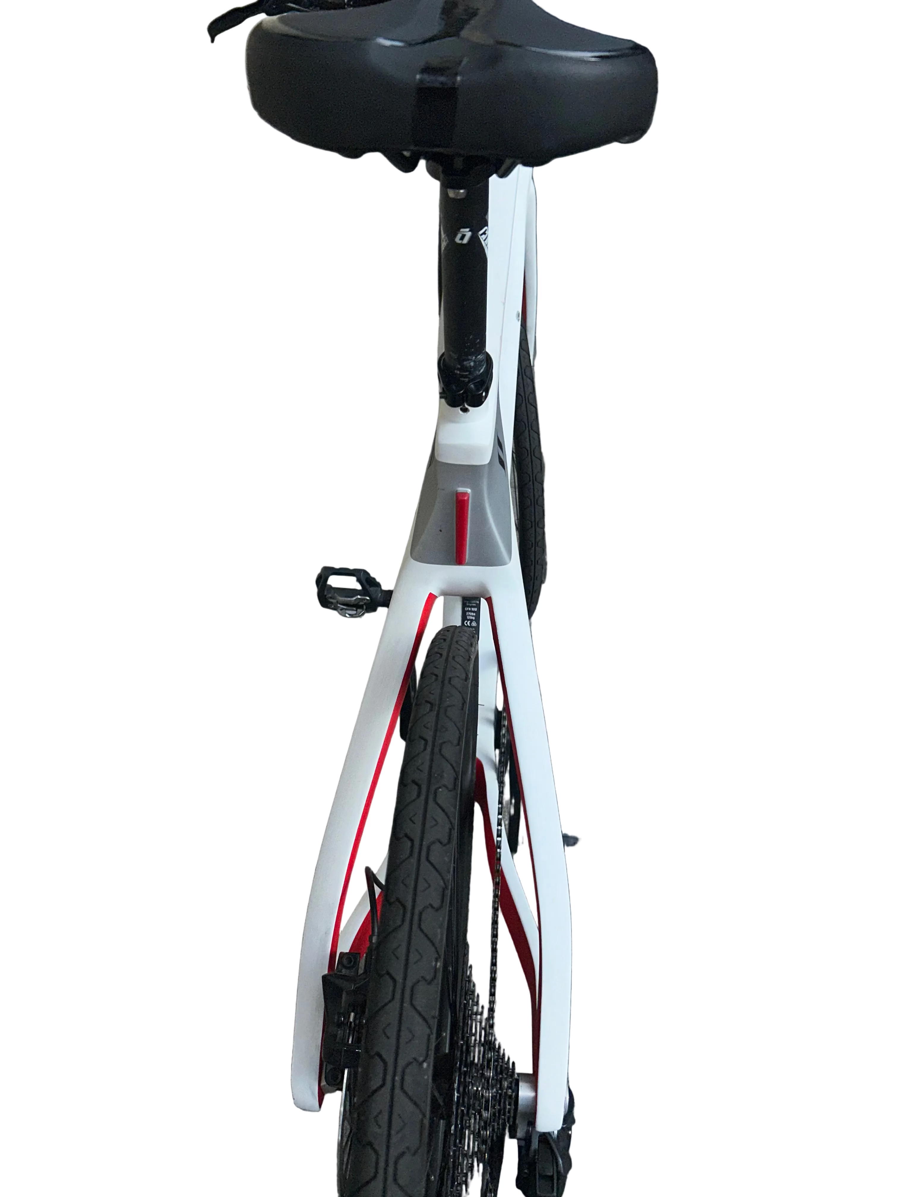 White bicycle with black seat on a gray pavement