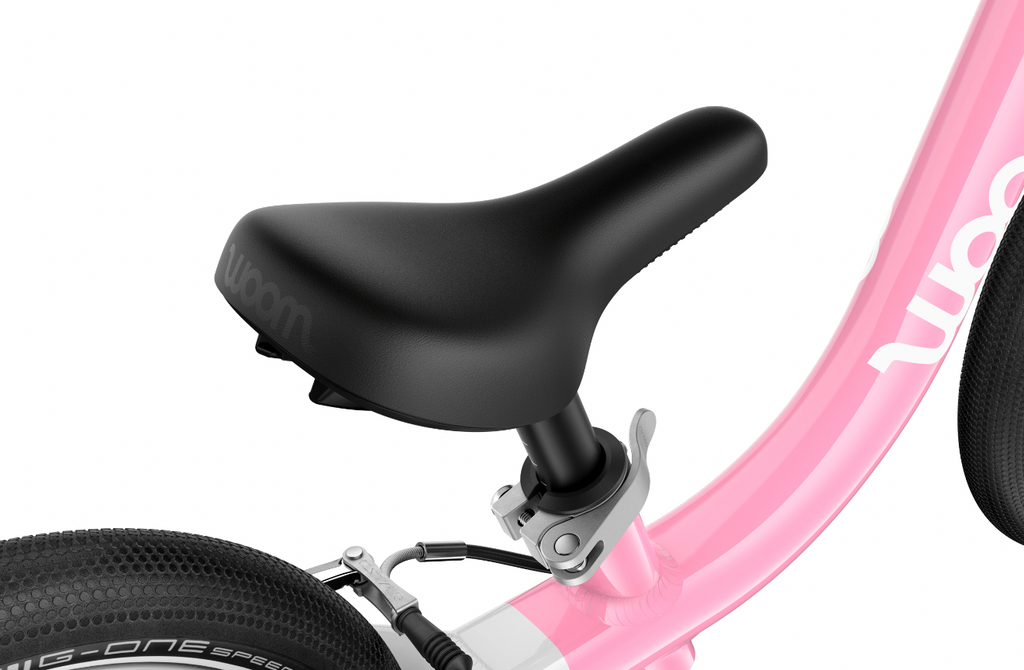 Toddler learning to ride on a lightweight woom GO 1 balance bike
