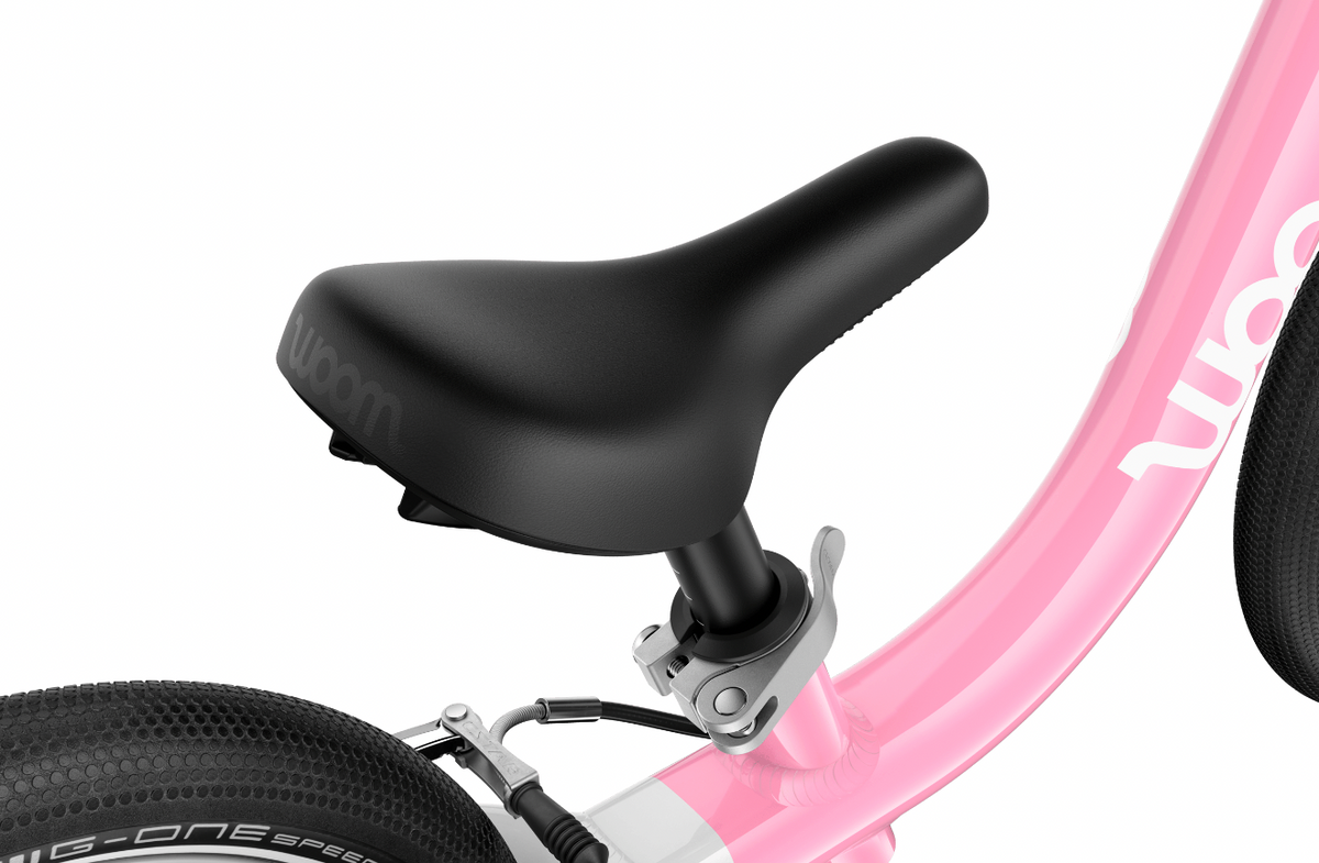 Toddler learning to ride on a lightweight woom GO 1 balance bike