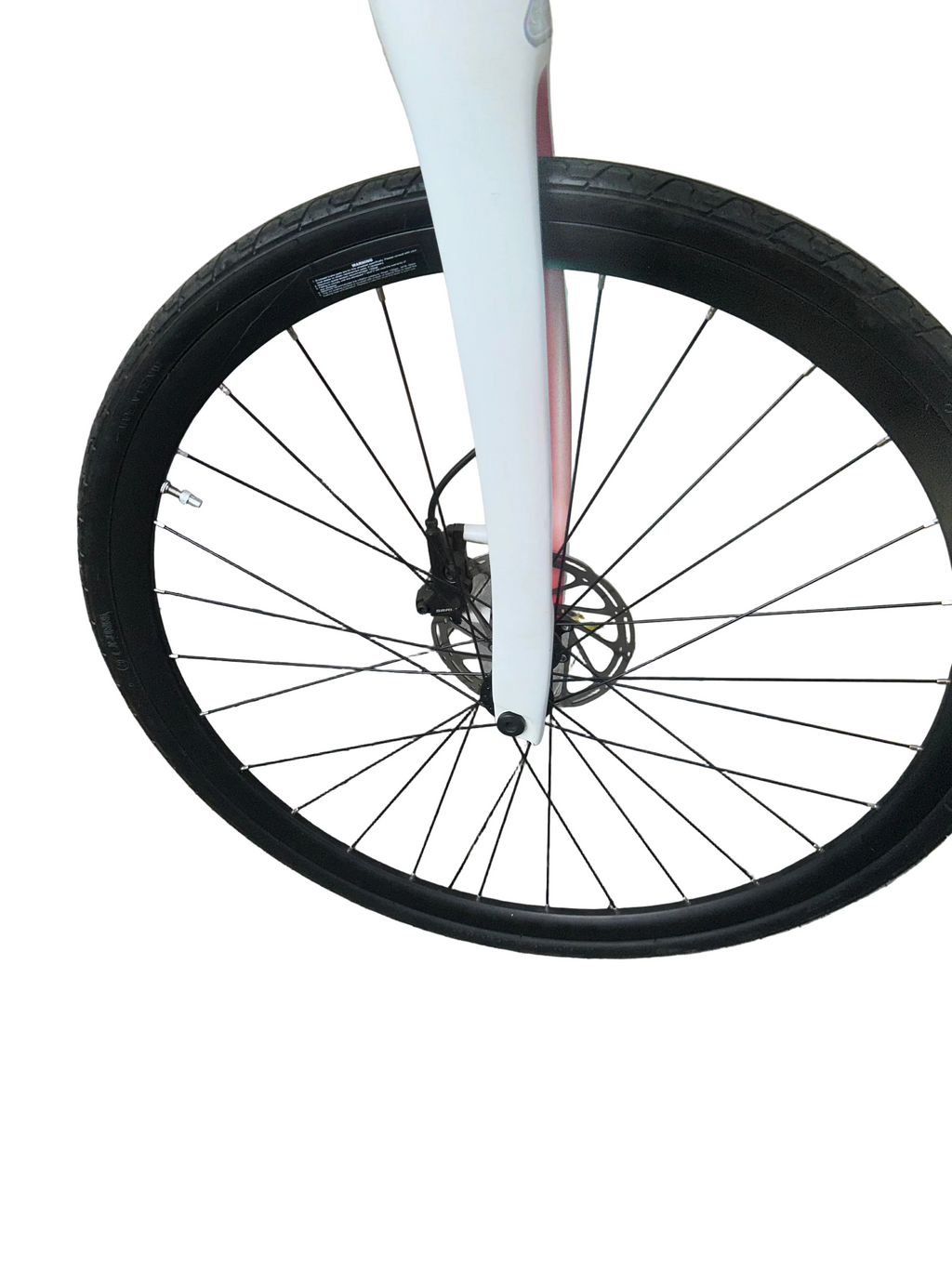 Close-up of a bicycle wheel on a paved surface