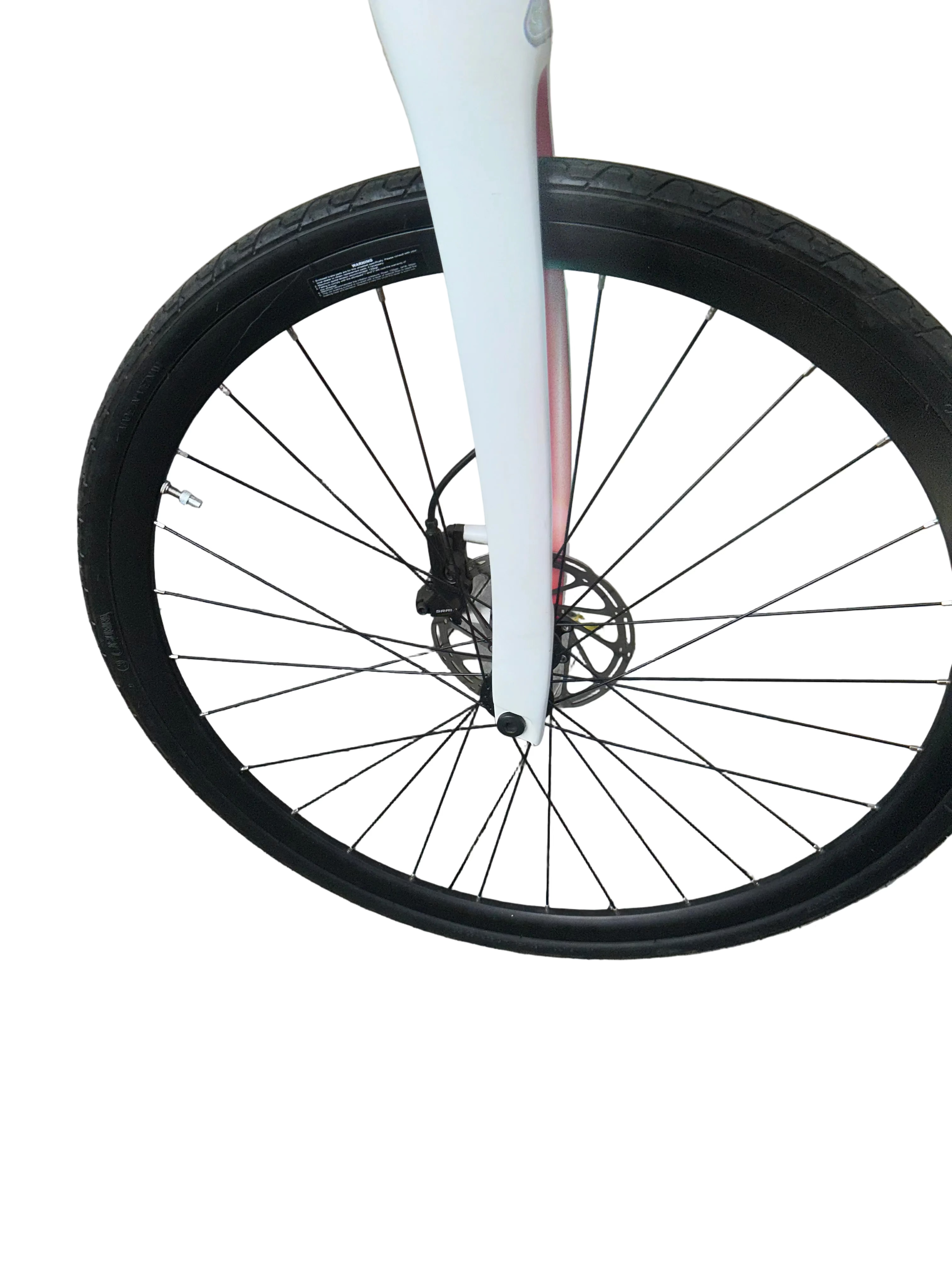 Close-up of a bicycle wheel on a paved surface