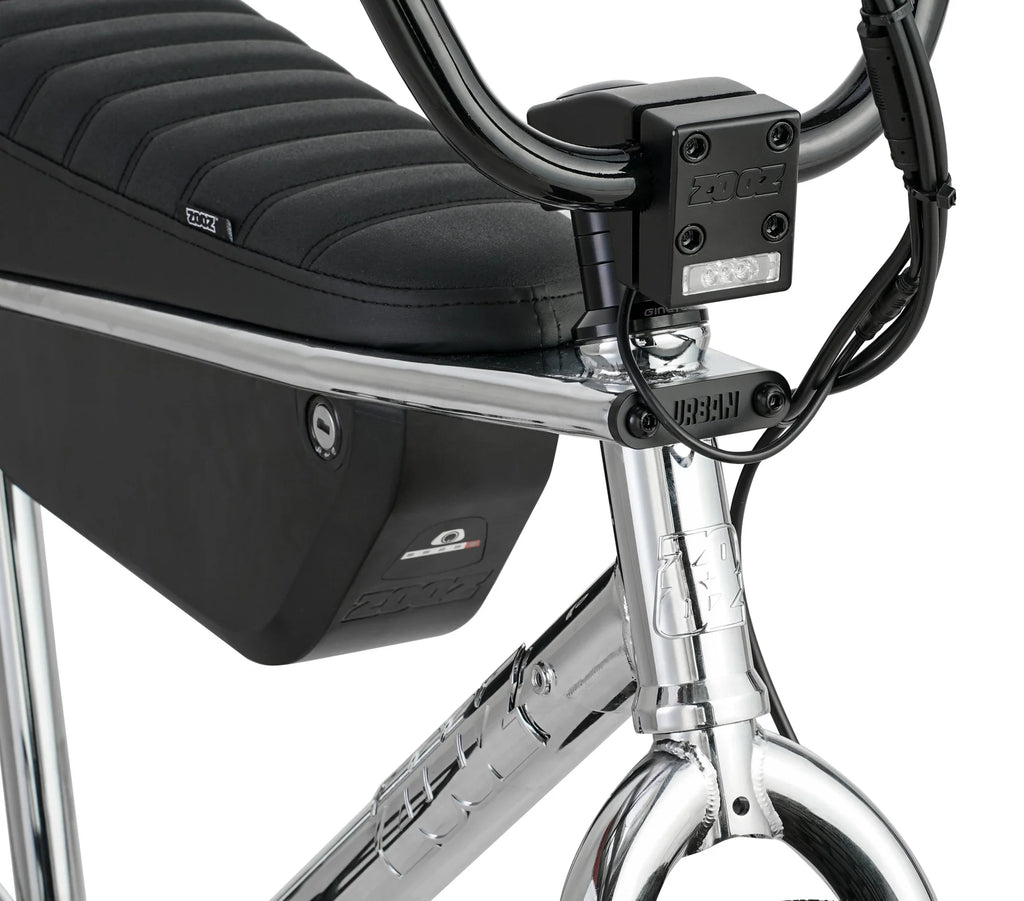 Close-up of a bicycle with a black seat and rear storage bag on a white background