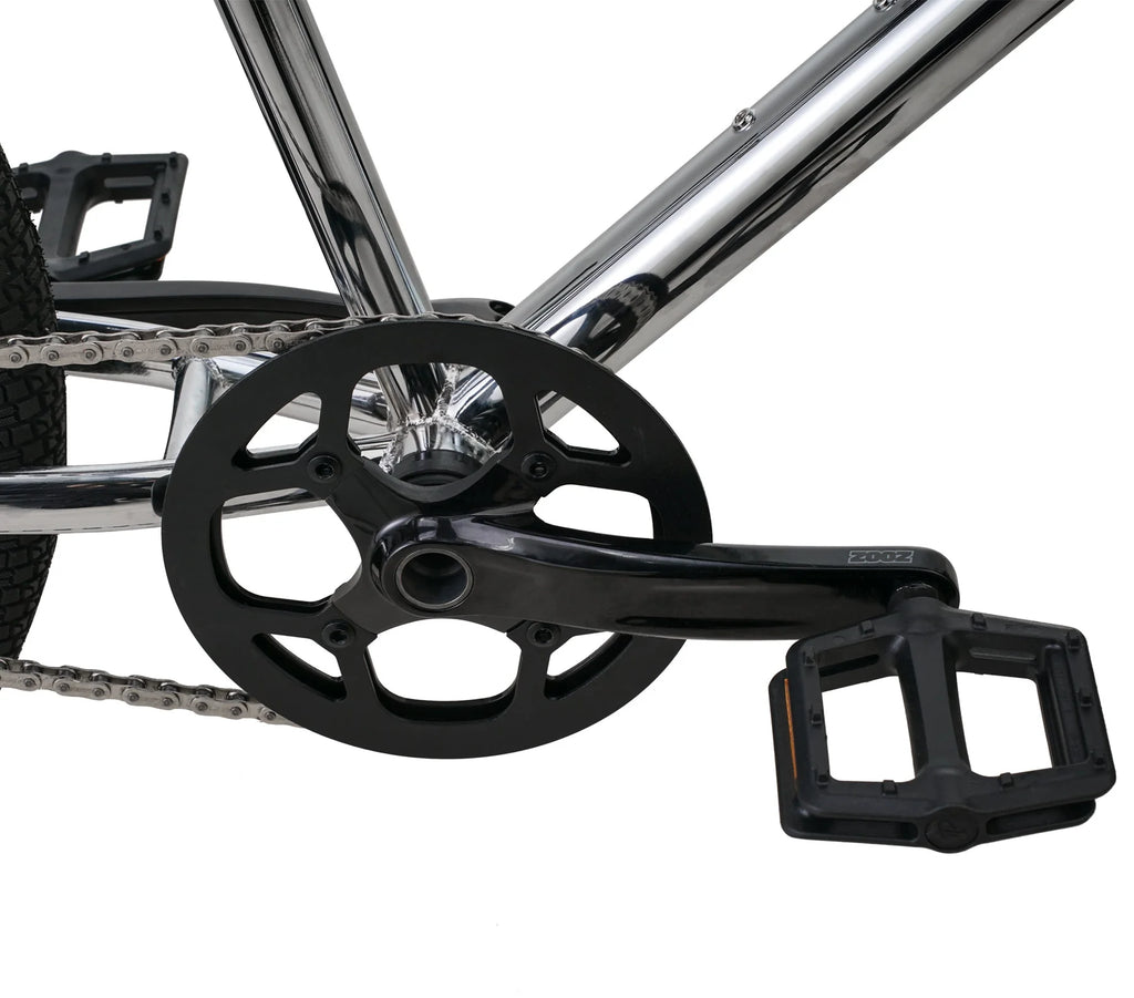 Close-up of a bicycle chain and gear system on a white background