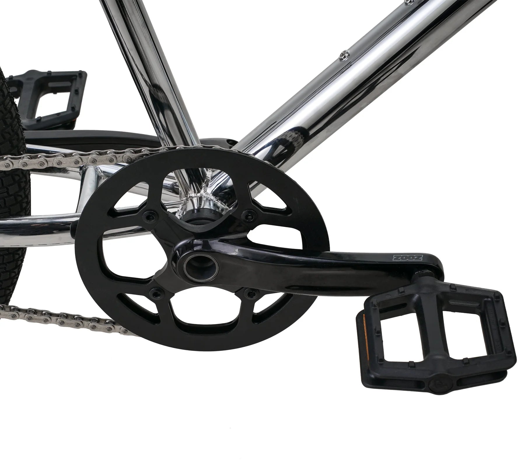 Close-up of a bicycle chain and gear system on a white background