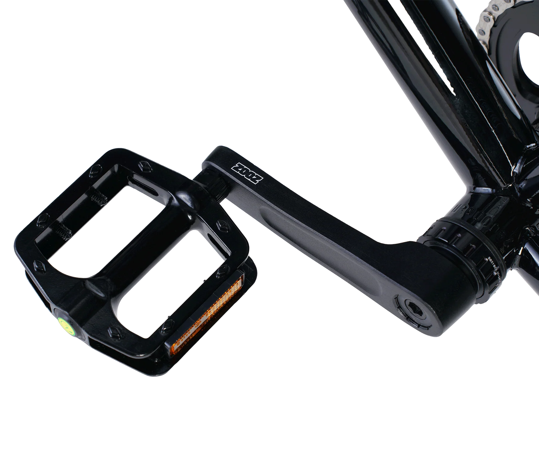 Close-up of a black bicycle pedal with a white background