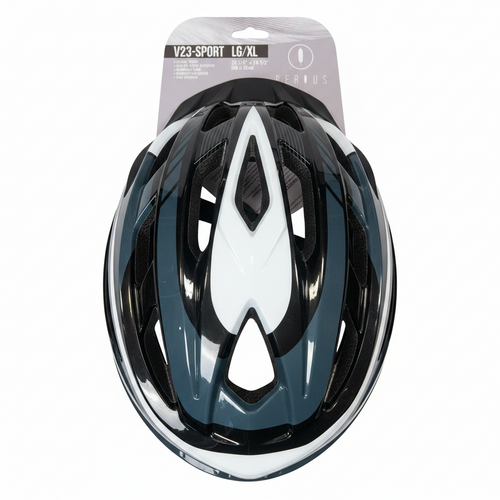 A black, white, and dark teal bicycle helmet in its original retail packaging, displayed flat on a light brown wooden floor. The packaging header card is visible at the top.