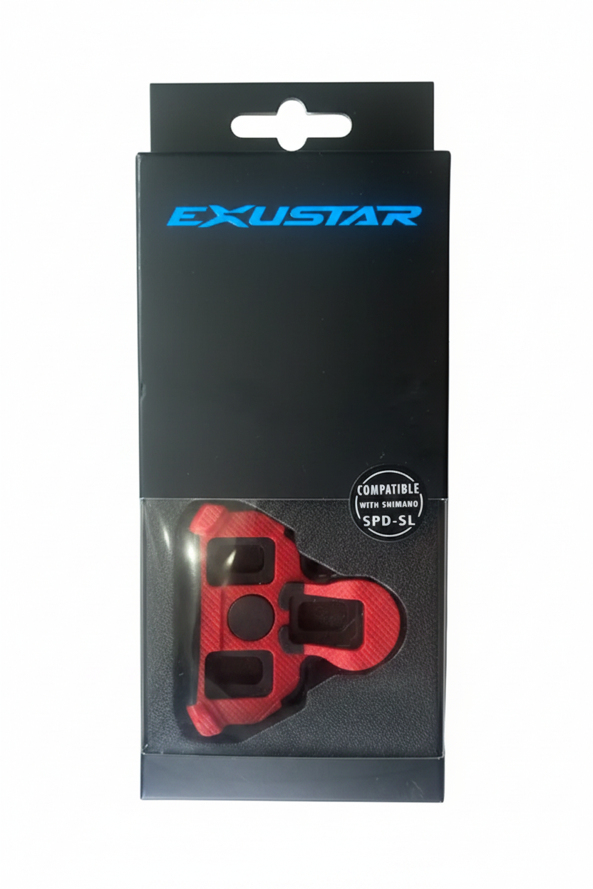A red carbon-fiber-patterned bicycle chainstay spacer or clip-in component in its original black retail packaging, displayed on a gray wood-plank floor. The packaging features the brand name 'EXUSTAR' in blue and a 'COMPATIBLE WITH SRAM SPD-S1' seal.
