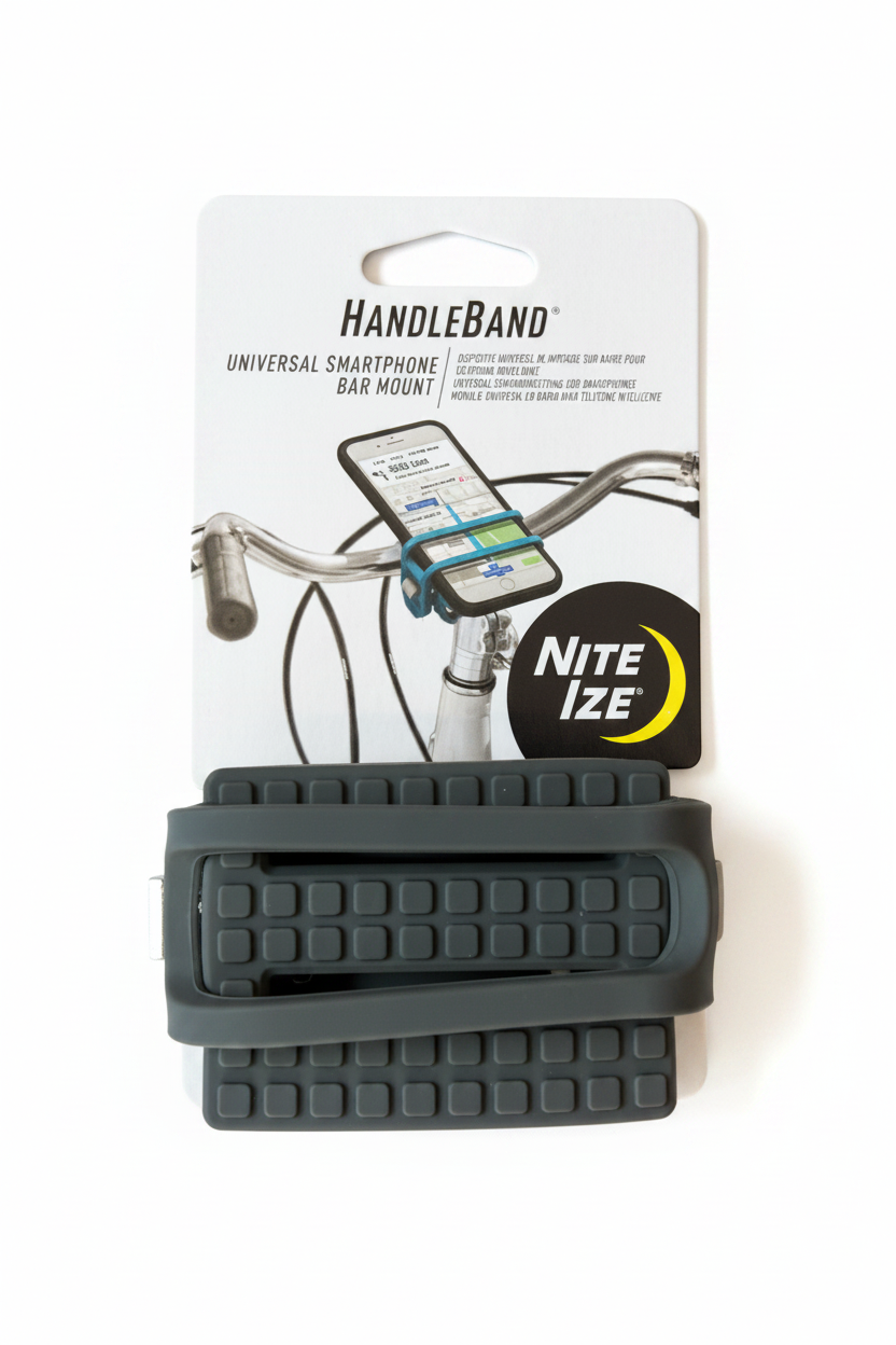 Nite Ize HandleBand Universal Smartphone Bar Mount in dark gray, shown attached to its retail packaging card on a light brown wooden surface. 