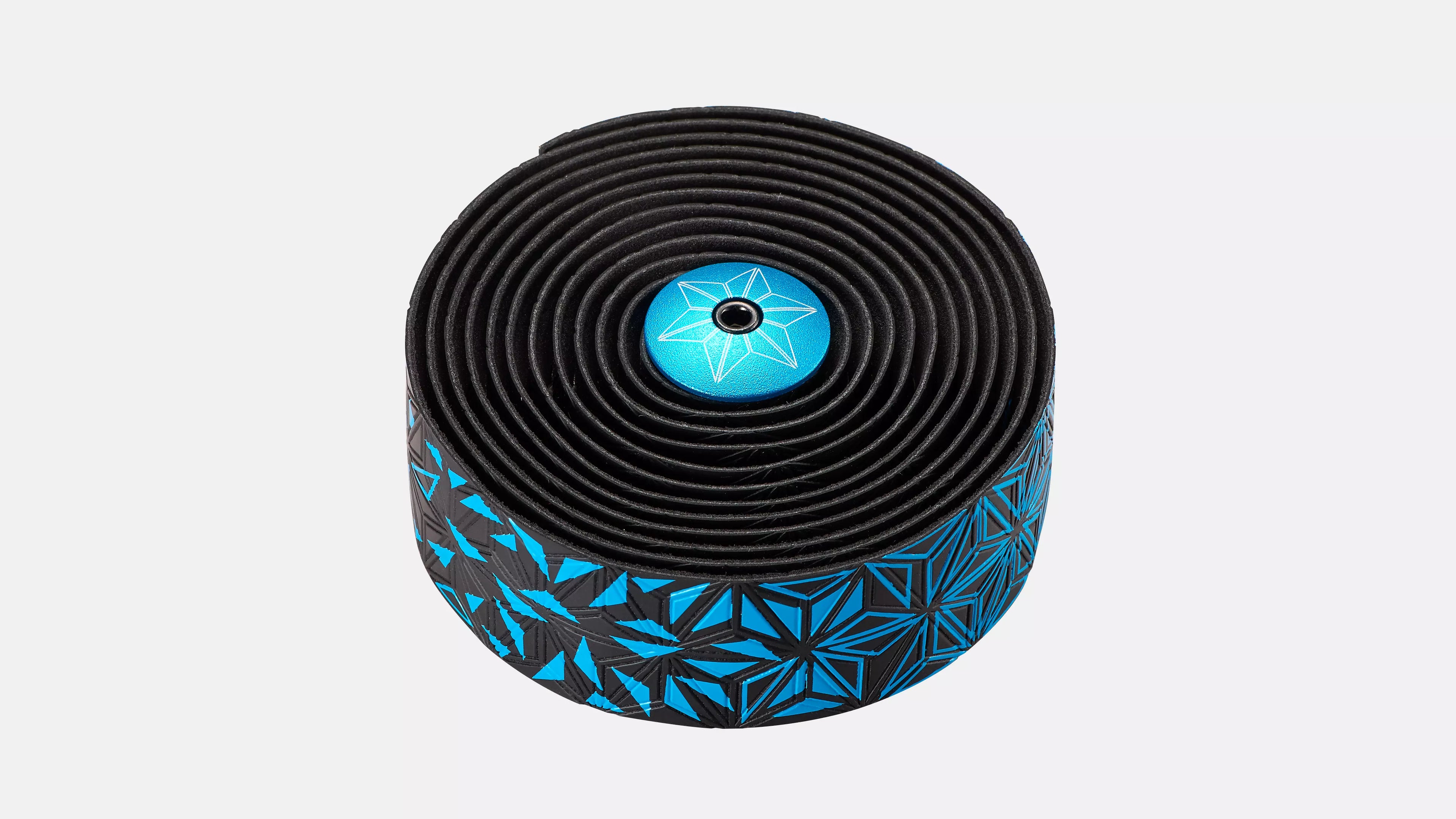 Roll of black and blue patterned tape on a white background
